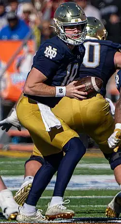 Steve Angeli hands a ball off in 2023 during the Sun Bowl