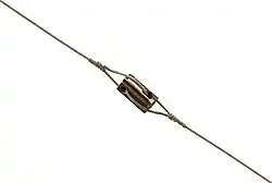 Low-voltage "egg"-type strain insulator, used in utility-pole guy cables to prevent any voltage on the guy caused by an electrical fault on the pole from reaching the lower sections accessible to the public