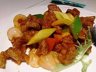 Sweet and sour pork, a Chinese dish that is popular in Europe and the Americas
