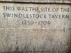 Plaque that reads "This was the site of Swindlestock Tavern 1250–1709"