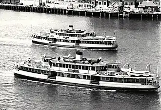 Karrabee (front) and sister Karingal as diesel vessels. The larger Karrabee had 13 windows along the top deck, in comparison to 11 on Karingal