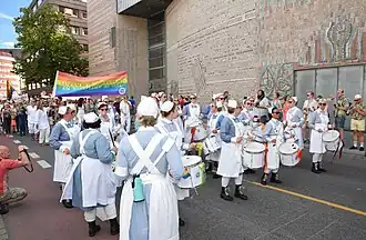 Nurses in traditional uniforms with drums during the 2016 parade.