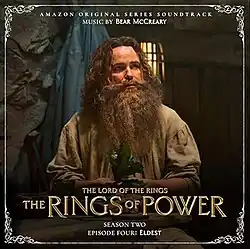 Album cover featuring a screenshot from the episode, depicting a bearded, long-haired man holding a plant.