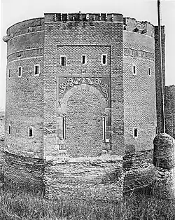 Black and white photograph of a large fortified tower