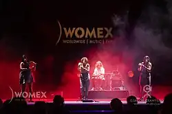 Tanxugueiras are a Galician folk trio formed in 2016. The group aim to bring a modern sound to traditional Galician music by merging folk sounds with pop and world music influences. Their music focuses on themes such as the understanding between peoples, the defence of the Galician language and culture, and women's empowerment.