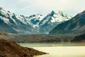 Mount Rudolf centred in the distance, and The Minarets (right). Tasman Lake in foreground.