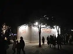 Temporary smoking room and a sales promotion of glo at the 2016 Sendai Pageant of Starlight in Kōtōdai-kōen Park.