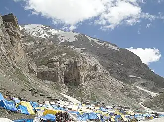 Tents are available to hire for a small fee near the base of the imposing Amarnath Cave as visible in the background.