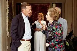 Thatcher standing with George H. W. Bush