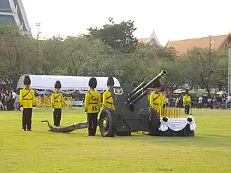 A company of the 1st Artillery Battalion prepared for a 21-gun salute in the royal cremation ceremony of Bejaratana Rajasuda, 2012.