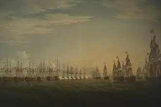 A painting showing a tightly packed line of 13 warships flying the French flag. The ships are firing on eight ships flying the British flag that are steadily approaching them from the right of the picture.