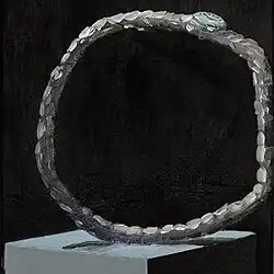 A dramatically widened hand watch.