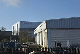 large modern building, white tiled.