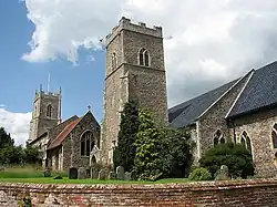 Church of the Nativity of St Mary with brick retaining wall to the north