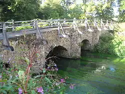 Bridge over the River Wey to the north-west corner of the green