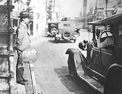 Image 18A Tokyo taxi driver indicating a fare of 50 Sen by holding up five fingers, in 1932 (from Transport in Greater Tokyo)
