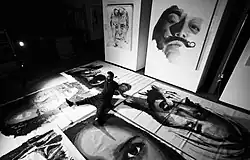 Artist Tomer Peretz and his piece 'Funeral' at an art exhibit 2012.