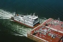 Towboat Ben McCool upbound on Ohio River at Matthew E. Welsh Bridge with two tank barges (3 of 6), near Mauckport, Indiana, USA, 1987