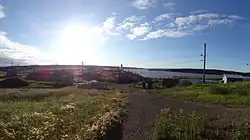 The Church in Tsiigehtchic with the Arctic Red River and Mackenzie River in the background
