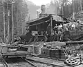 Men standing beside a donkey engine at the Brown & Kirkland Logging Co. Ltd. 1928.
