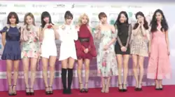 An image of Twice at a red carpet event.