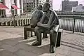 Two Men on a Bench, at Wren Landing, Canary Wharf, London