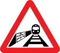 Warning sign for a level crossing with a user operated gate ahead