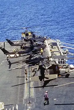 US Army Sikorsky UH-60 Black Hawk, Bell AH-1 Cobra and Bell OH-58 Kiowa helicopters on deck of the US Navy aircraft carrier USS Dwight D. Eisenhower off Haiti, 1994.