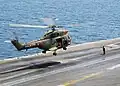 A French Army Light Aviation SA 330 Puma lands on USS&nbsp;George Washington
