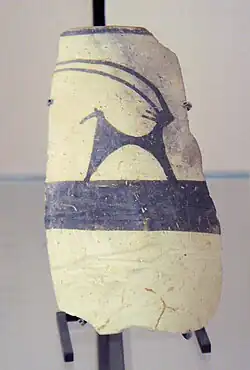 Fragment of pottery with a painting of an Ibex; 4700–4200 BC; painted ceramic; from Girsu; Louvre[36]