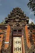 Richly decorated Indonesian Balinese temple gate called Paduraksa