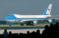 Image 8A Boeing 747 aircraft with livery designating it as Air Force One. The cyan forms, the US flag, presidential seal and the Caslon lettering, were all designed at different times, by different designers, for different purposes, and combined by designer Raymond Loewy in this one single aircraft exterior design. (from Graphic design)