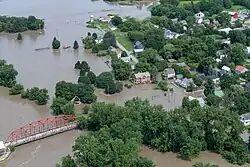 A picture from a National Guard helicopter shows an aerial view of flooding over the village of Richmond, Vermont on July 11.