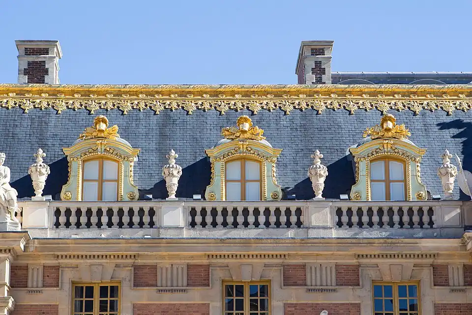 Urns that decorate the roof railing of the Marble Court of the Palace of Versailles, Versailles, France, by Louis Le Vau and Jules Hardouin-Mansart, c. 1660–1715[181]
