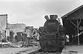 Abandoned CC50 19 at Kroya Station, with the destroyed station building in the background, October 1947