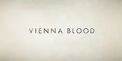 A distressed cream colored background to the logotype "Vienna Blood"