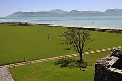 Photo of the view across a body of water towards a hilly island