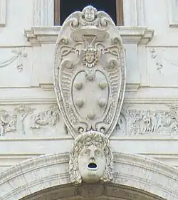 The Medici coat of arms with five balls, above Loggia dei leoni