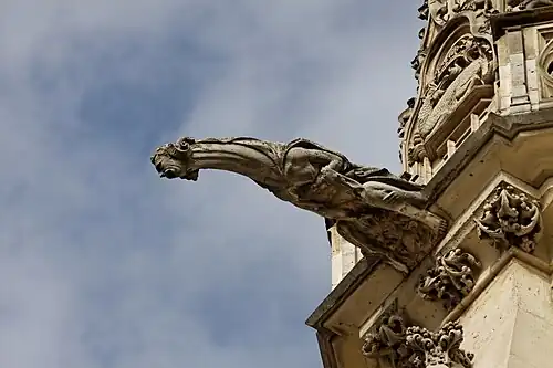 A gargoyle, serving as a rain spout
