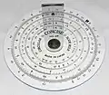 A simple circular slide rule, made by Concise Co., Ltd., Tokyo, Japan, with only inverse, square, and cubic scales. On the reverse is a handy list of 38 metric/imperial conversion factors.