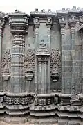 Wall relief, turret, pilasters with miniature decorative towers in Mallikarjuna temple at Kuruvatti