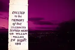 A white memorial with black writing