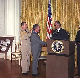 Image 22Disney receiving the Presidential Medal of Freedom in 1964 from President Lyndon B. Johnson. (from Walt Disney)