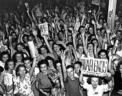 Citizens and workers of Oak Ridge, Tennessee celebrate V-J Day on August 14, 1945[b]
