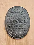 The explanatory plaque on the façade (in Polish)