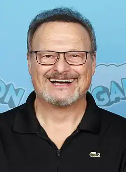 Knight smiling in front of a blue background