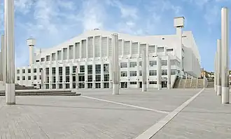 A white building adorned with many windows.