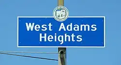 West Adams Heights neighborhood sign located at the intersection of Western Avenue and the Santa Monica Freeway