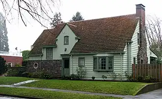 A photograph of a beaux-arts suburban home