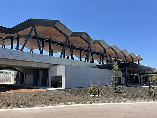 An elevated train station on a concrete viaduct